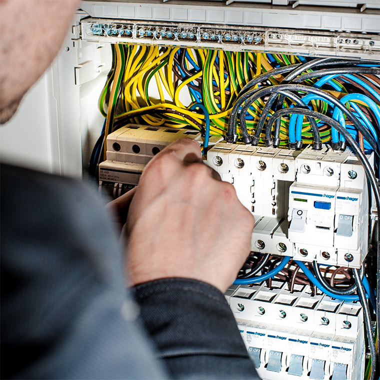 Electricians in Portland fixing electric panel